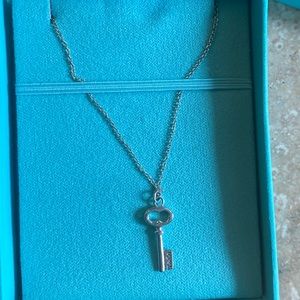 Authentic mini key necklace.